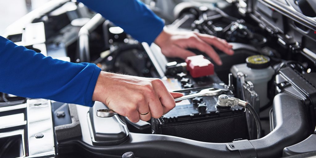 Certified mechanic inspecting GMC  vehicle routine service and maintenance